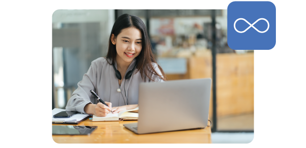 female researcher on laptop in library setting with perpetual icon in the top right of the image