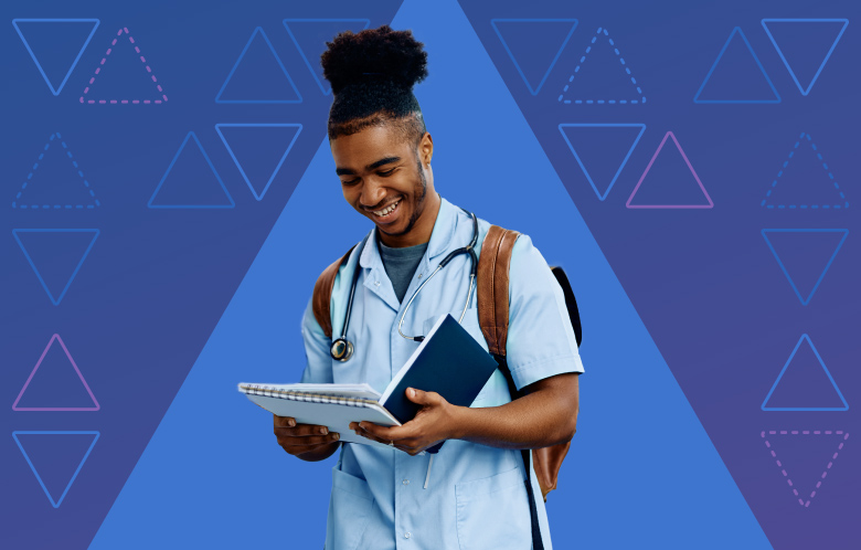 Male African American medical student wearing a backpack and stethoscope while looking at a notebook