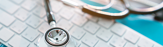 medical stethoscope on keyboard