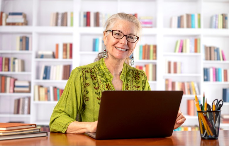 Librarian working at a laptop