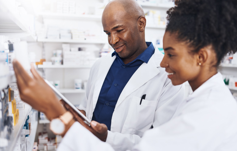Two pharmacists working together in the pharmacy