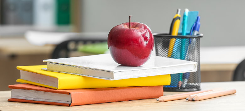 an apple on school notebooks