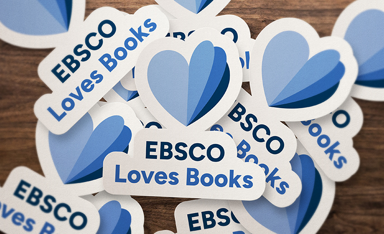 EBSCO Loves Books stickers scattered on wooden table