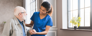 a nurse helping an elderly patient