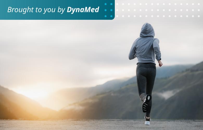 Person running with a mountain view