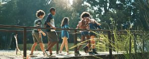 children walking on a footbridge