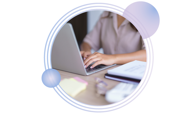 library worker researching on laptop at a desk with circle pattern behind the image