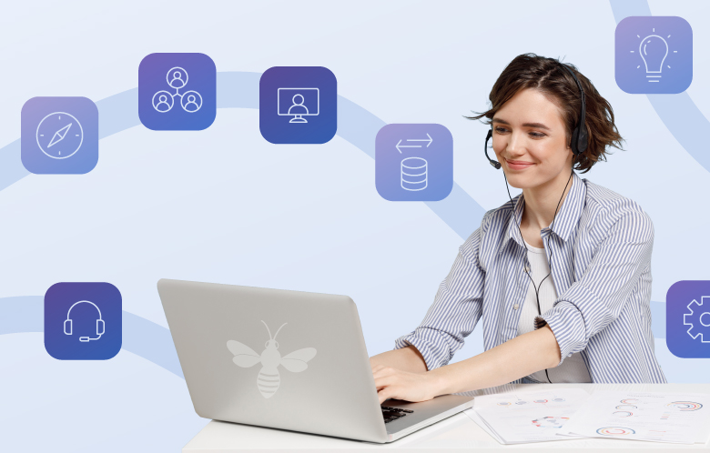 Woman wearing a headset typing on a laptop with path of 7 icons