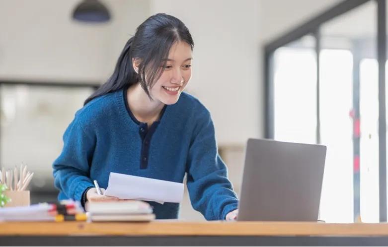 Young professional woman working at a laptop