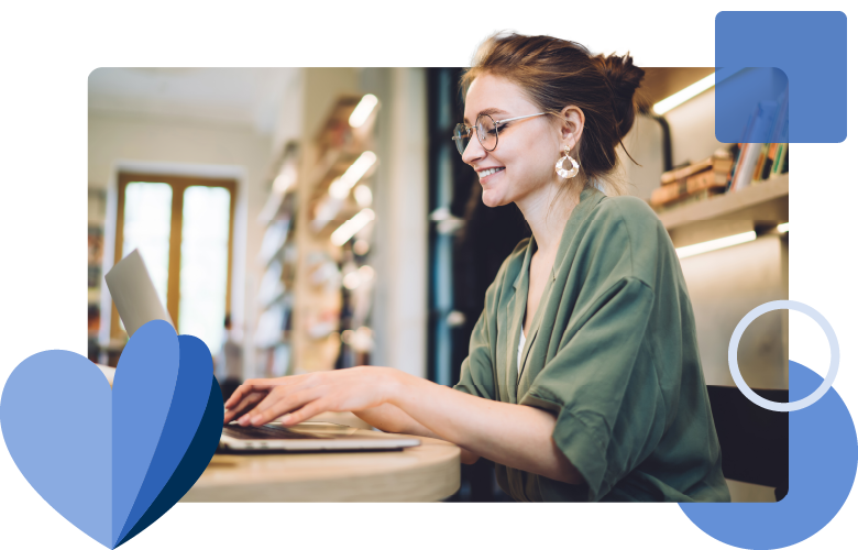 Librarian in library on laptop