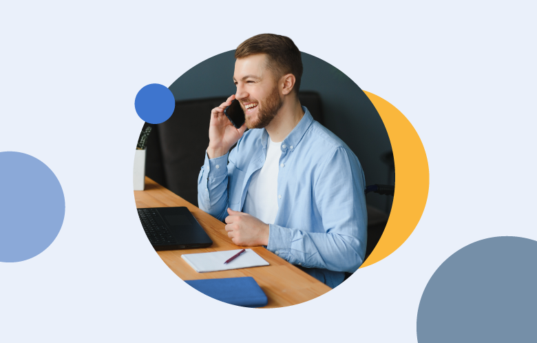 Male job applicant interviewing for a job at a desk with circle shapes