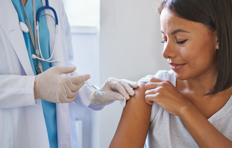 Image of a patient receiving a shot from a doctor