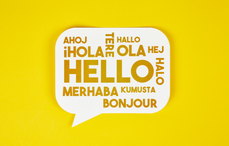 Graphic with the word hello in different languages inside a chat bubble.
