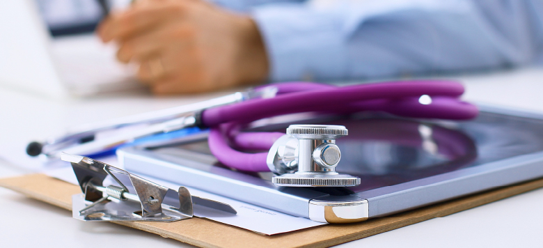 Tablet and clipboard with a stethoscope