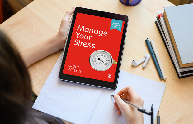 Student looking at Manage Your Stress in tablet
