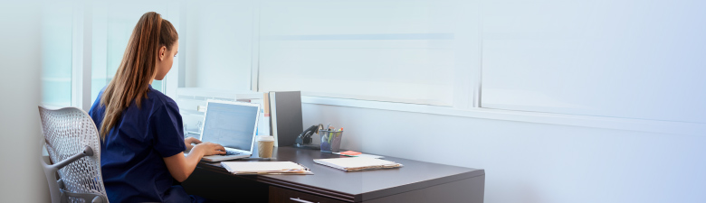 A nurse during nursing research at a desk