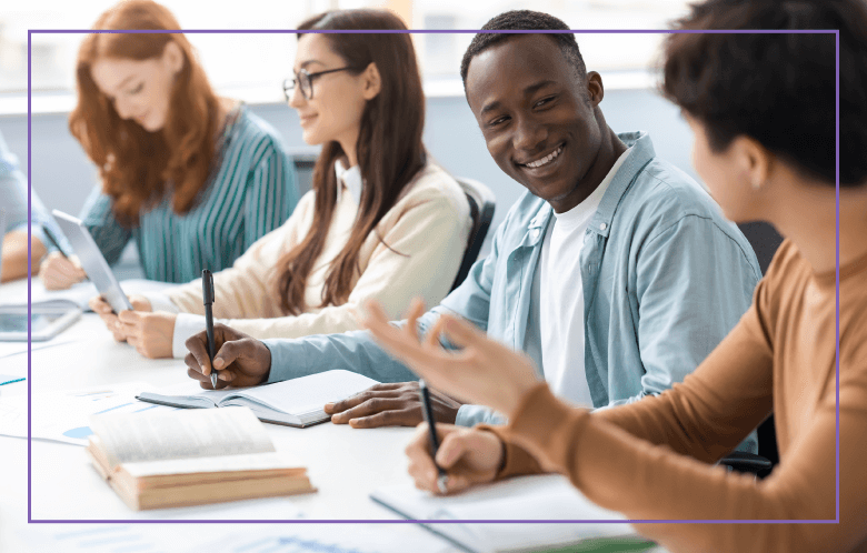 Students collaborating on research in school