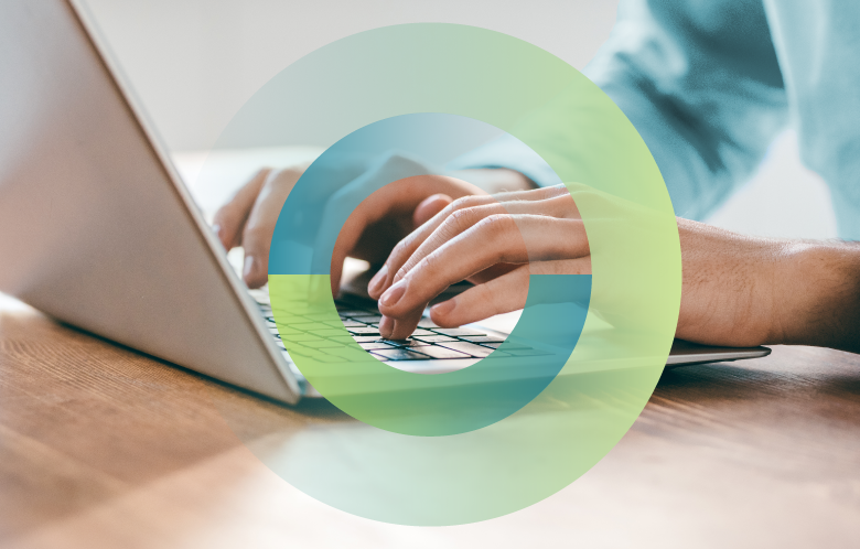 User on a laptop with gradient circles around their hands