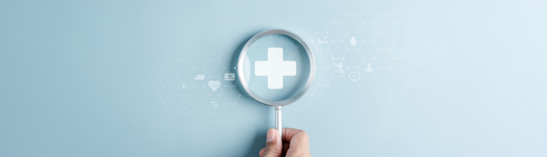 a magnifying glass over a medical cross symbol