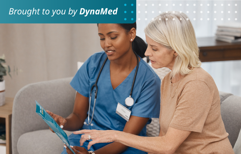 Nurse looking over a brochure with a patient. 