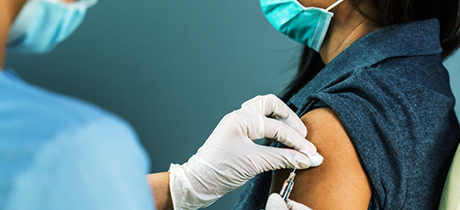 Patient receiving vaccine in their arm