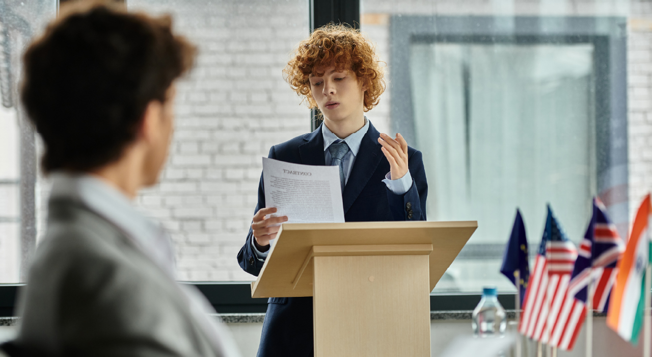 Young student presenting at debate.