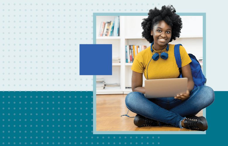 a business student sitting with a laptop and backpack