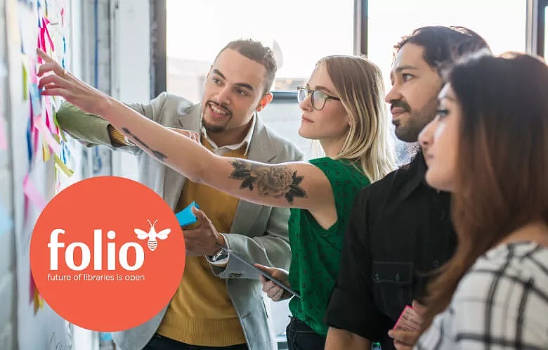 Group of people talking and researching at a tablet